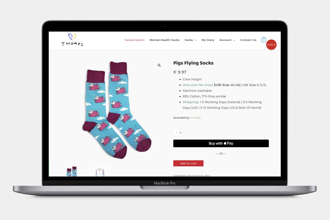 A product page for socks displayed on an Apple MacBook Pro.