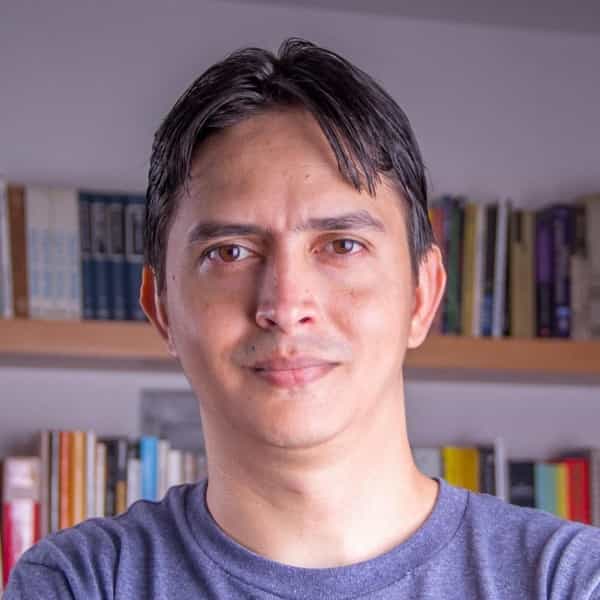 Yordan Soares pictured in front of a bookcase packed with books